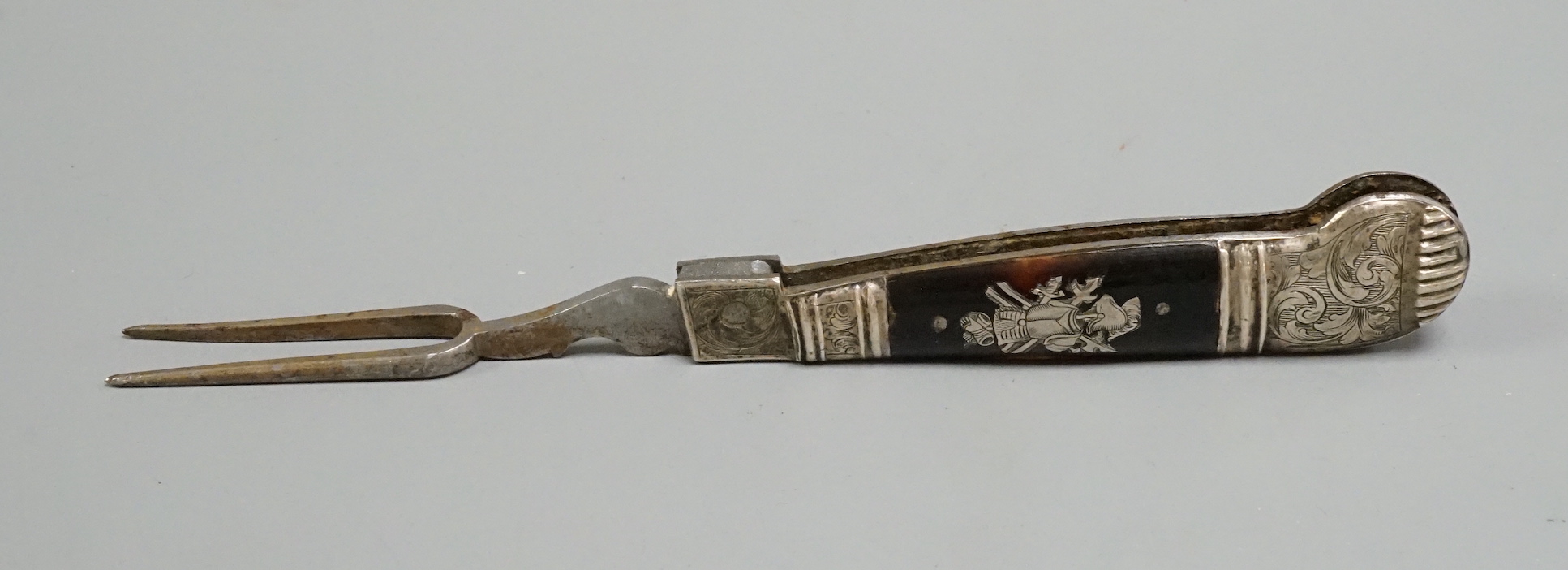 A 17th century white metal and tortoiseshell mounted pistol handled folding fork, 17.4cm.